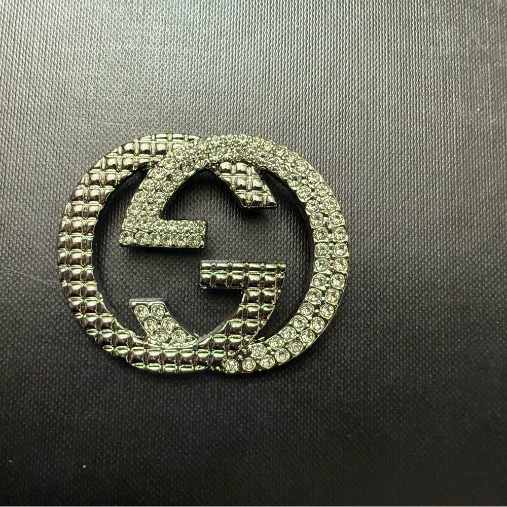 Brand new Gucci Silver Crystal Brooch Aprox 1.5”h 2”h no box